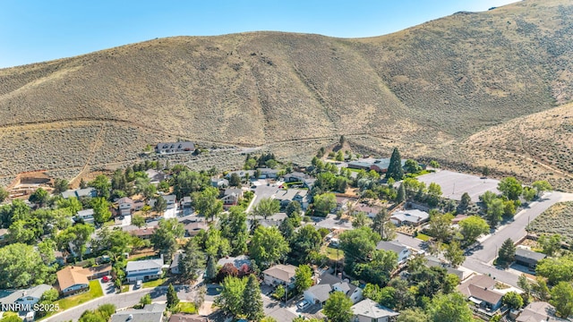 700 Highland St, Carson City, NV 89703 - aerial view of property's location with a mountain backdrop and nearby suburban area
