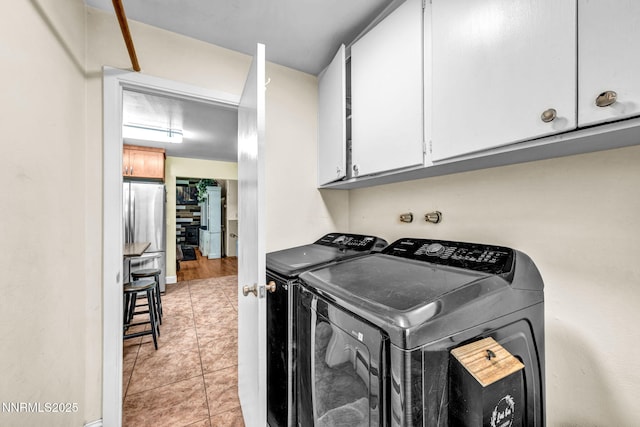 700 Highland St, Carson City, NV 89703 - laundry area with separate washer and dryer, cabinet space, and light tile patterned floors