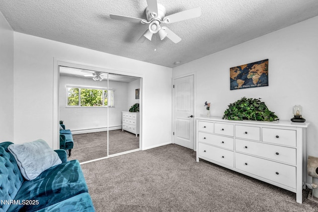 700 Highland St, Carson City, NV 89703 - living area with a baseboard radiator, a ceiling fan, carpet, and a textured ceiling