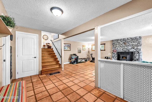 700 Highland St, Carson City, NV 89703 - entrance foyer with a textured ceiling, stairs, and a fireplace