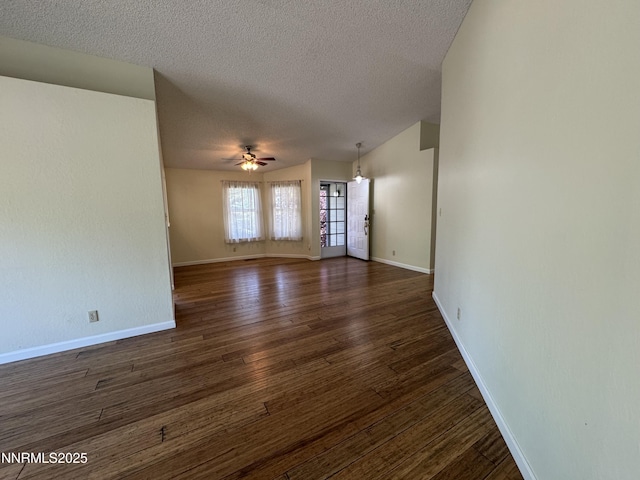 6559 Fall River Cir, Reno, NV 89523 - empty room with a textured ceiling, ceiling fan, and dark wood-style flooring