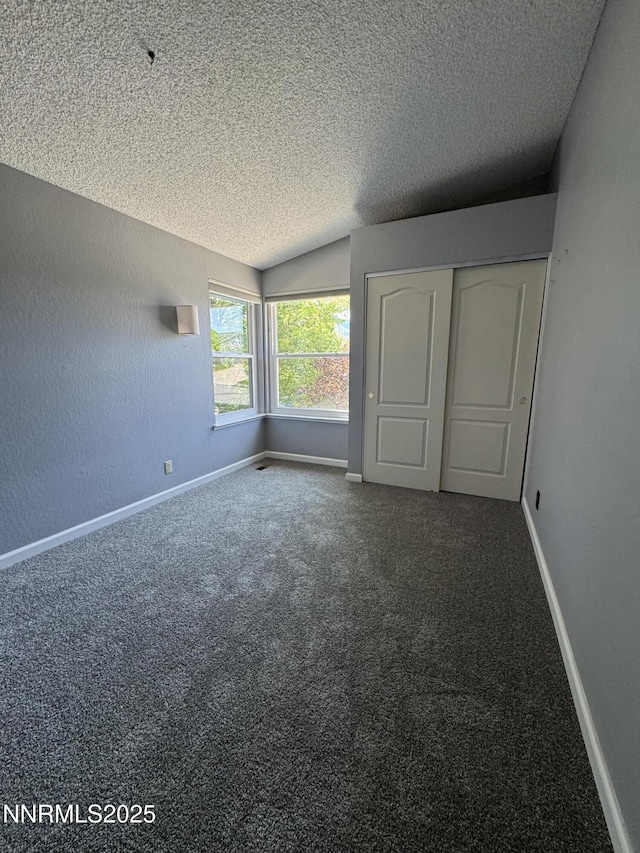 6559 Fall River Cir, Reno, NV 89523 - unfurnished bedroom with a textured ceiling, carpet floors, and a closet