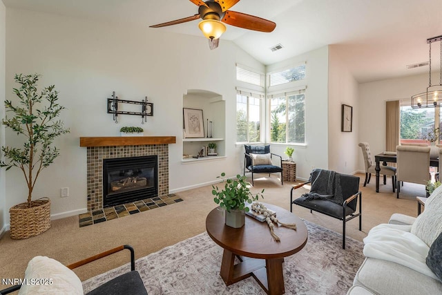 7436 Baysheen Ct, Sparks, NV 89436 - living area with carpet floors, plenty of natural light, ceiling fan, high vaulted ceiling, and a fireplace