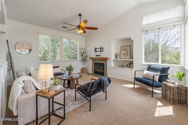 7436 Baysheen Ct, Sparks, NV 89436 - living area with ceiling fan, a fireplace, light colored carpet, and high vaulted ceiling