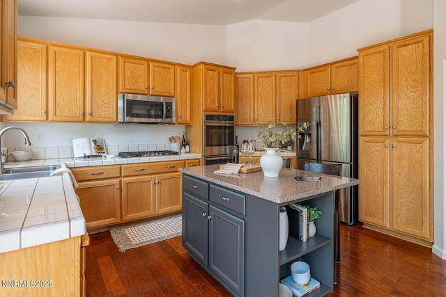 7436 Baysheen Ct, Sparks, NV 89436 - kitchen with appliances with stainless steel finishes, tile countertops, dark wood-type flooring, open shelves, and high vaulted ceiling