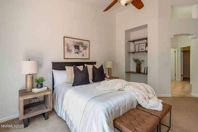 7436 Baysheen Ct, Sparks, NV 89436 - carpeted bedroom featuring arched walkways and a ceiling fan