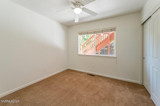 7436 Baysheen Ct, Sparks, NV 89436 - spare room featuring light colored carpet and a ceiling fan