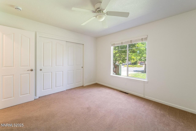 7436 Baysheen Ct, Sparks, NV 89436 - unfurnished bedroom with carpet, a closet, and ceiling fan