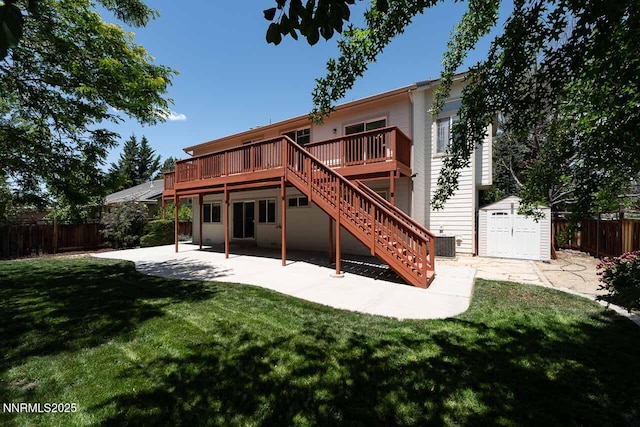 7436 Baysheen Ct, Sparks, NV 89436 - back of property with a storage shed, a fenced backyard, a patio area, and a deck