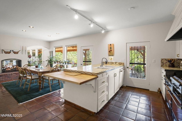 2548 Jacks Valley Rd, Genoa, NV 89411 - kitchen with a peninsula, healthy amount of natural light, white cabinetry, butcher block counters, and recessed lighting