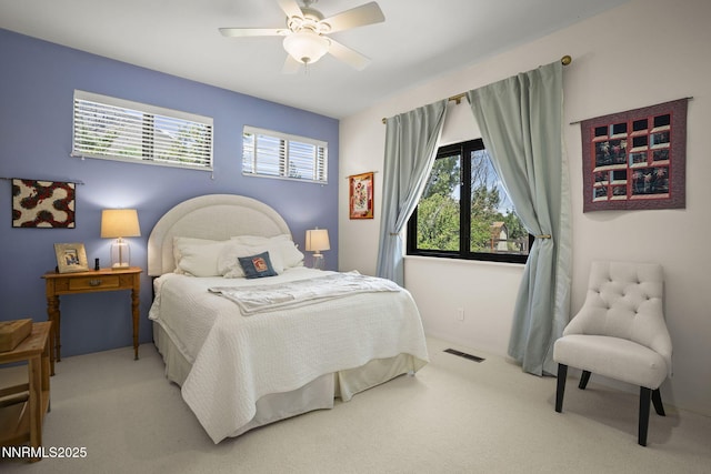 2548 Jacks Valley Rd, Genoa, NV 89411 - bedroom featuring multiple windows, light colored carpet, and a ceiling fan