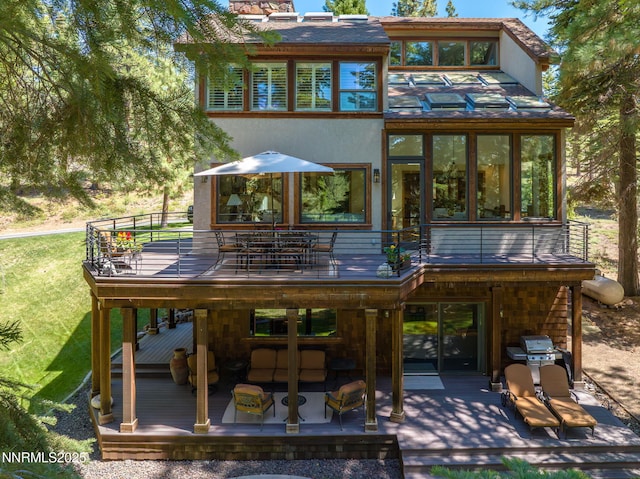 5 Kelly Cir, Glenbrook, NV 89413 - rear view of property with outdoor dining space, a wooden deck, and a balcony