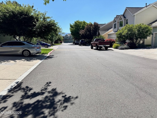 4066 Snowshoe Ln, Reno, NV 89502 - view of asphalt road featuring a residential view, curbs, and sidewalks