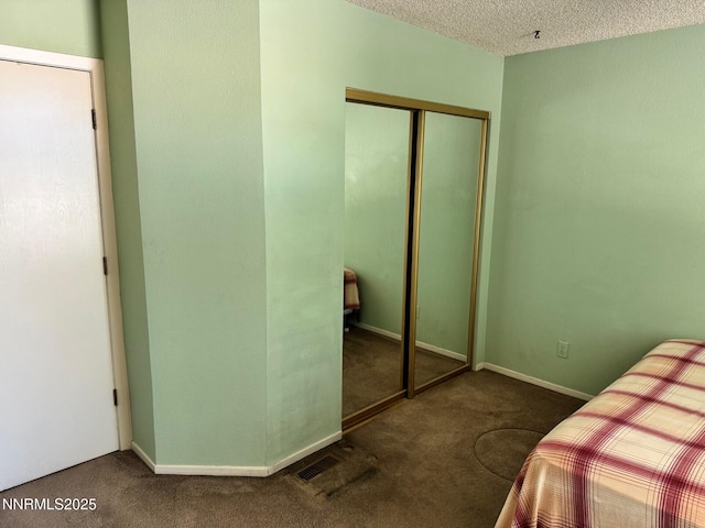 4066 Snowshoe Ln, Reno, NV 89502 - unfurnished bedroom featuring carpet floors, a closet, and a textured ceiling