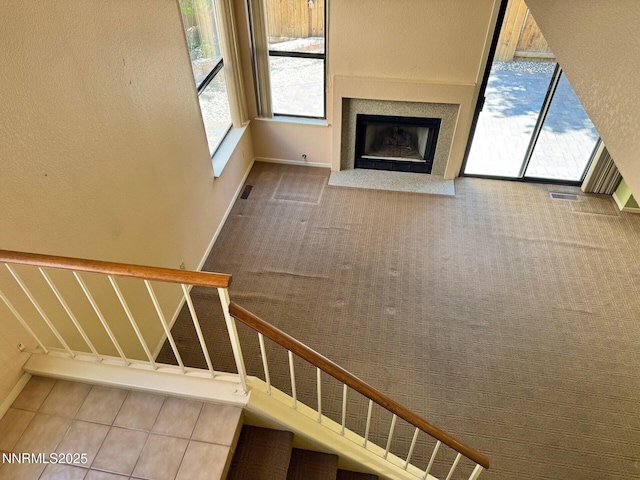 4066 Snowshoe Ln, Reno, NV 89502 - staircase featuring a fireplace with flush hearth and baseboards
