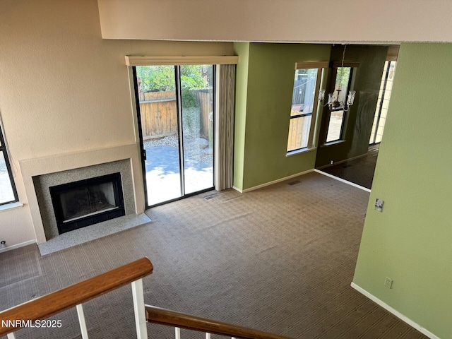 4066 Snowshoe Ln, Reno, NV 89502 - unfurnished living room with carpet and a fireplace with flush hearth