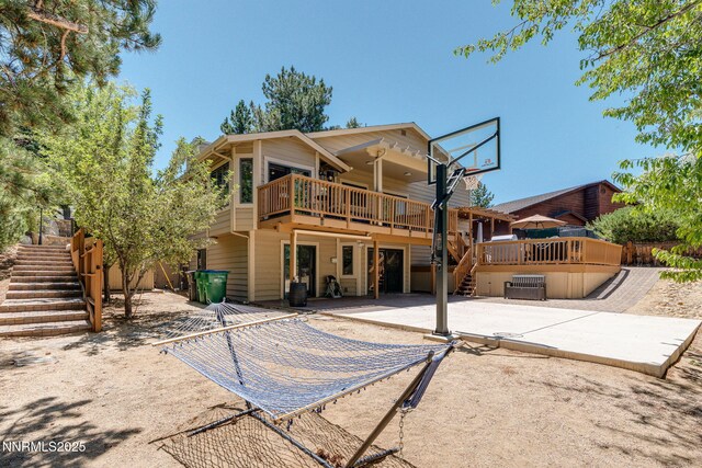 3597 Skyline View Dr, Reno, NV 89509 - back of house featuring stairs, a patio, and a wooden deck