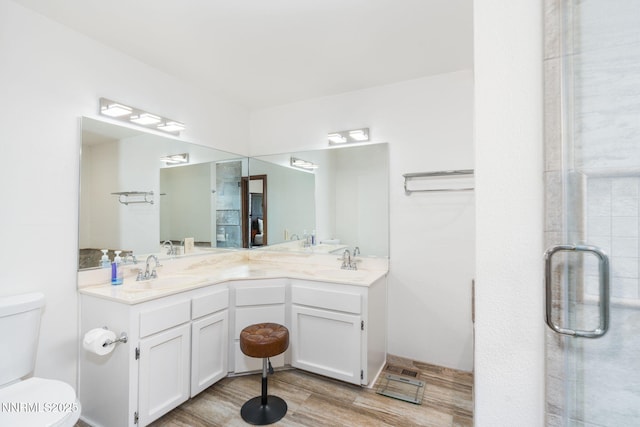 3597 Skyline View Dr, Reno, NV 89509 - bathroom featuring double vanity, a shower stall, and wood finished floors