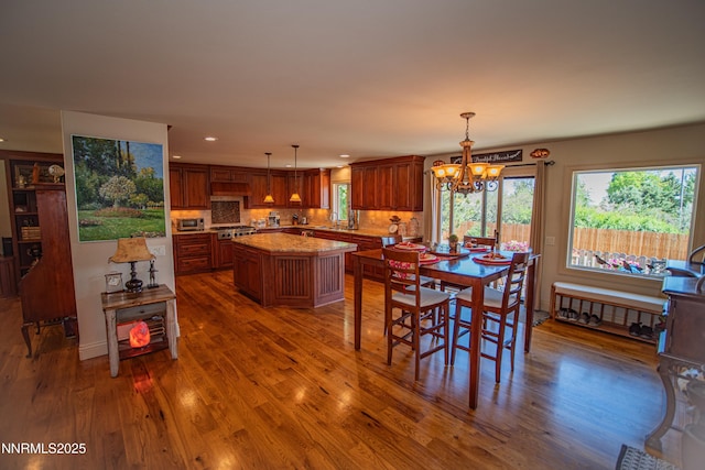15045 Heathcliff Dr, Reno, NV 89511 - dining space with a chandelier, dark wood-type flooring, and recessed lighting