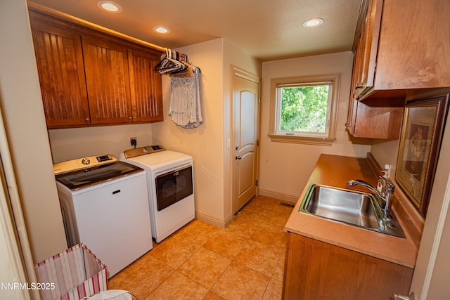 15045 Heathcliff Dr, Reno, NV 89511 - washroom with washing machine and clothes dryer, cabinet space, recessed lighting, and light tile patterned floors