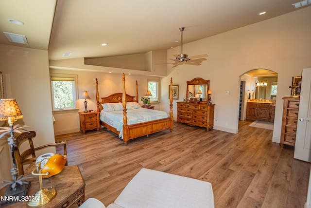 15045 Heathcliff Dr, Reno, NV 89511 - bedroom featuring lofted ceiling, light wood-style flooring, arched walkways, recessed lighting, and ensuite bathroom