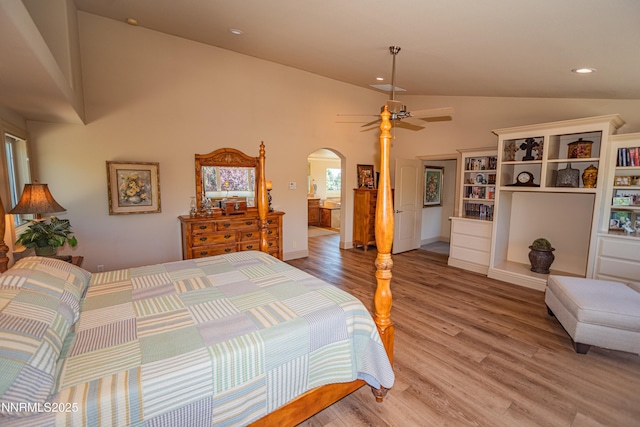 15045 Heathcliff Dr, Reno, NV 89511 - bedroom with arched walkways, light wood-style flooring, recessed lighting, and high vaulted ceiling
