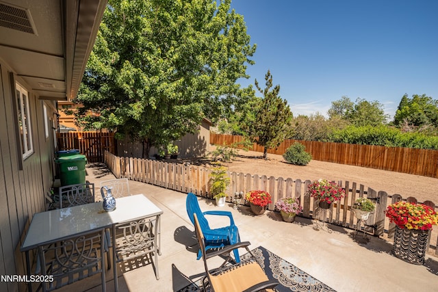 15045 Heathcliff Dr, Reno, NV 89511 - fenced backyard with a patio and outdoor dining area