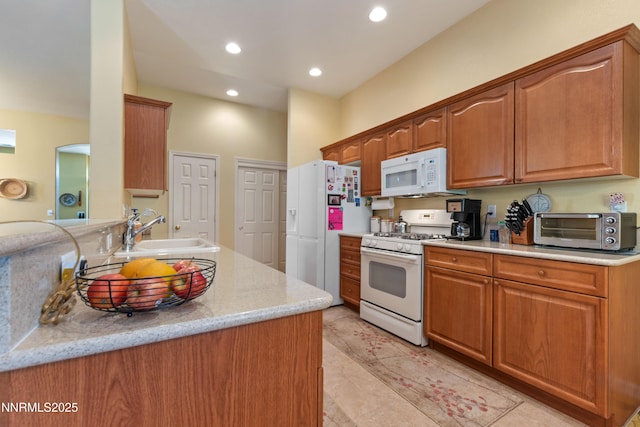 1719 Colavita Way, Reno, NV 89521 - kitchen with white appliances, recessed lighting, brown cabinets, and light tile patterned floors