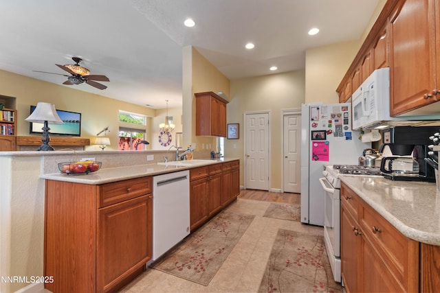 1719 Colavita Way, Reno, NV 89521 - kitchen with white appliances, ceiling fan, brown cabinetry, recessed lighting, and a peninsula