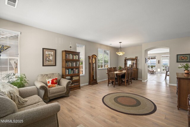 3226 Banestone Rd, Sparks, NV 89436 - living room with arched walkways and light wood finished floors