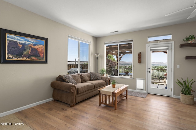 3226 Banestone Rd, Sparks, NV 89436 - living area with light wood-type flooring, plenty of natural light, and a ceiling fan