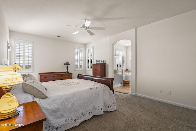 3226 Banestone Rd, Sparks, NV 89436 - bedroom featuring arched walkways, multiple windows, carpet flooring, and a ceiling fan