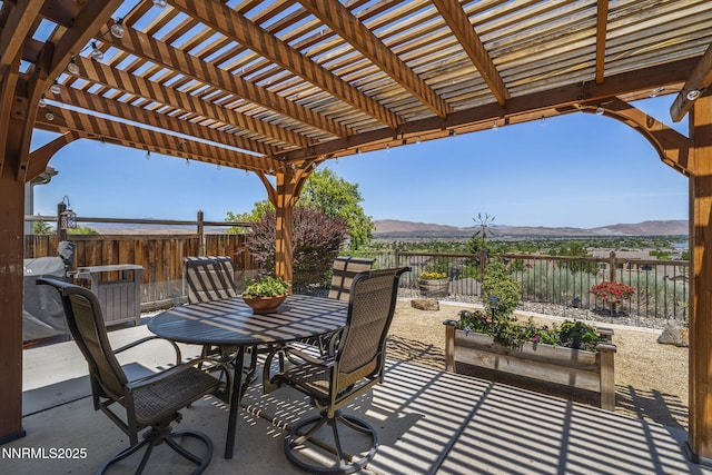 3226 Banestone Rd, Sparks, NV 89436 - view of patio / terrace with a mountain view, outdoor dining space, and a pergola
