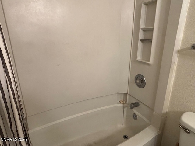 1465 E Peckham Ln Unit 53, Reno, NV 89502 - bathroom featuring toilet and shower / bath combo with shower curtain