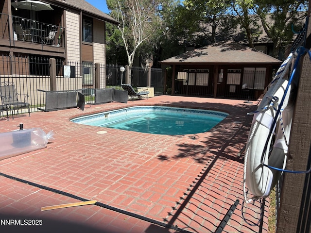 1465 E Peckham Ln Unit 53, Reno, NV 89502 - view of swimming pool featuring a patio
