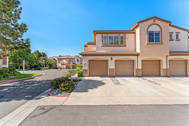 6120 Ingleston Dr Unit 621, Sparks, NV 89436 - multi unit property featuring stucco siding, a garage, and concrete driveway