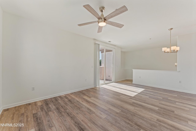 6120 Ingleston Dr Unit 621, Sparks, NV 89436 - spare room featuring light wood-style floors, a chandelier, and ceiling fan