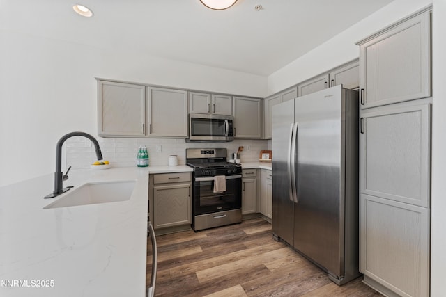6120 Ingleston Dr Unit 621, Sparks, NV 89436 - kitchen with appliances with stainless steel finishes, gray cabinetry, light stone countertops, backsplash, and recessed lighting