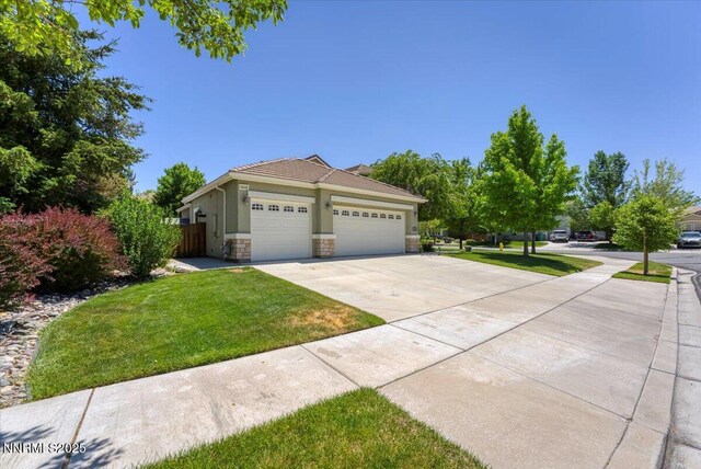 6648 Equation Dr, Sparks, NV 89436 - view of front of home with a garage, concrete driveway, stone siding, and stucco siding