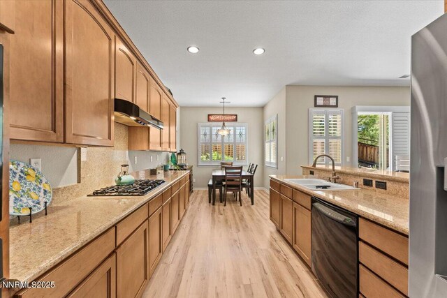 6648 Equation Dr, Sparks, NV 89436 - kitchen with appliances with stainless steel finishes, light wood-type flooring, under cabinet range hood, recessed lighting, and plenty of natural light