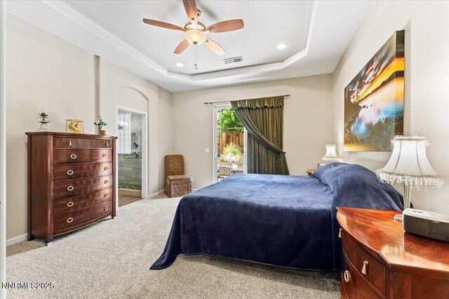 6648 Equation Dr, Sparks, NV 89436 - bedroom with access to outside, light colored carpet, a tray ceiling, recessed lighting, and a ceiling fan