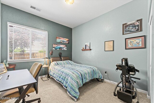 6648 Equation Dr, Sparks, NV 89436 - carpeted bedroom featuring a textured wall and a desk