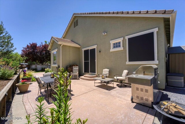 6648 Equation Dr, Sparks, NV 89436 - back of property featuring stucco siding and a patio area
