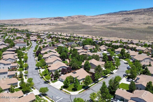 6648 Equation Dr, Sparks, NV 89436 - aerial view of property and surrounding area with mountains and nearby suburban area
