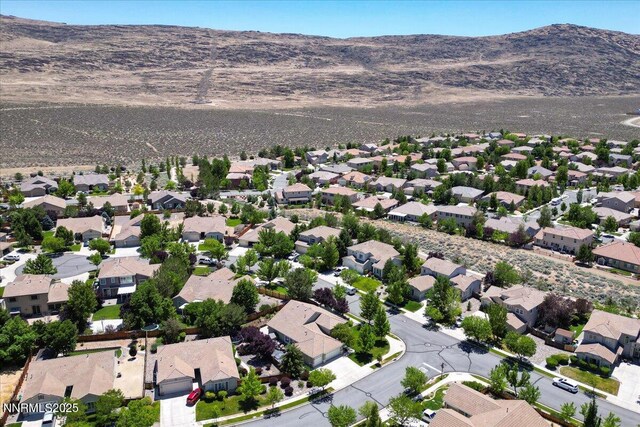 6648 Equation Dr, Sparks, NV 89436 - aerial perspective of suburban area with a mountainous background