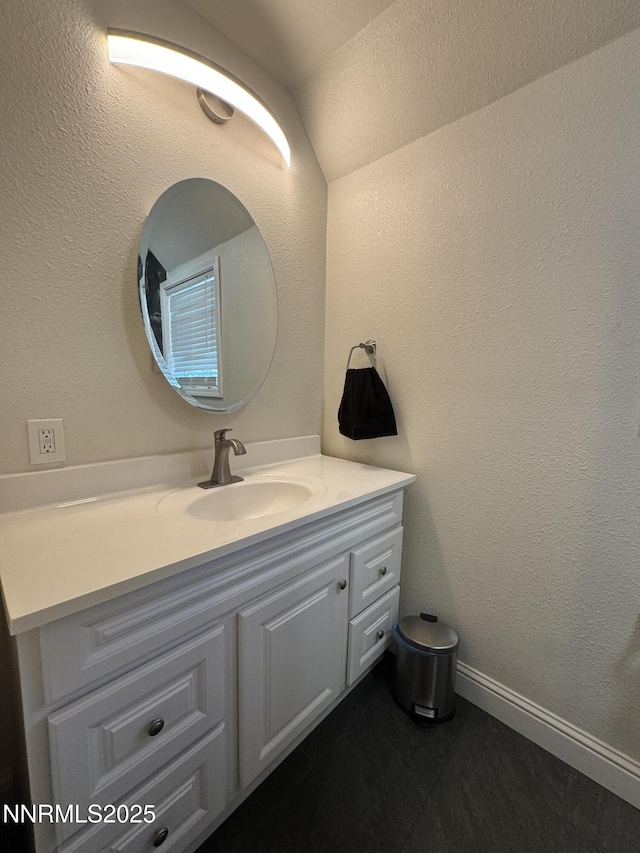 468 S Maine St, Fallon, NV 89406 - bathroom featuring vanity and lofted ceiling