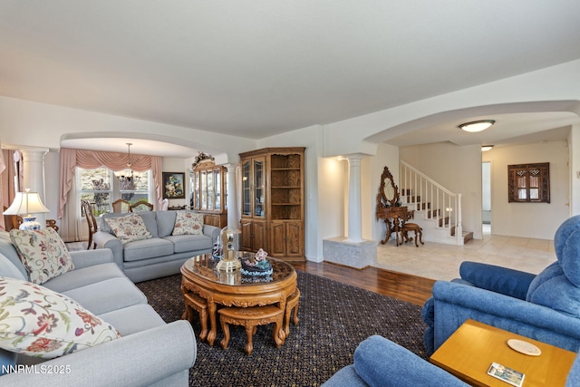 3555 Vista Blvd, Sparks, NV 89436 - living area featuring decorative columns, arched walkways, stairs, and wood finished floors