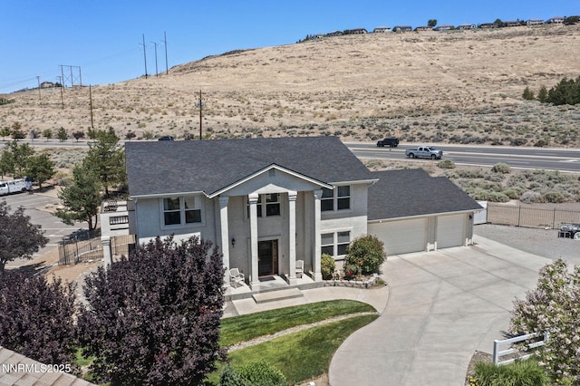 3555 Vista Blvd, Sparks, NV 89436 - neoclassical home with driveway, stucco siding, a mountain view, an attached garage, and roof with shingles
