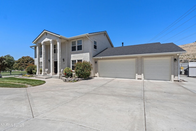3555 Vista Blvd, Sparks, NV 89436 - neoclassical home with driveway, stucco siding, and a garage