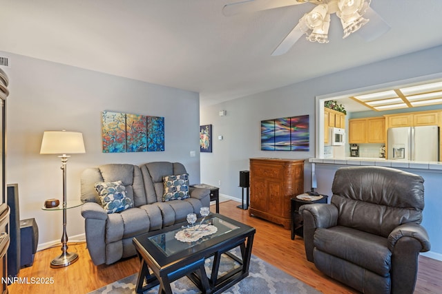 3555 Vista Blvd, Sparks, NV 89436 - living room with light wood-style floors and a ceiling fan